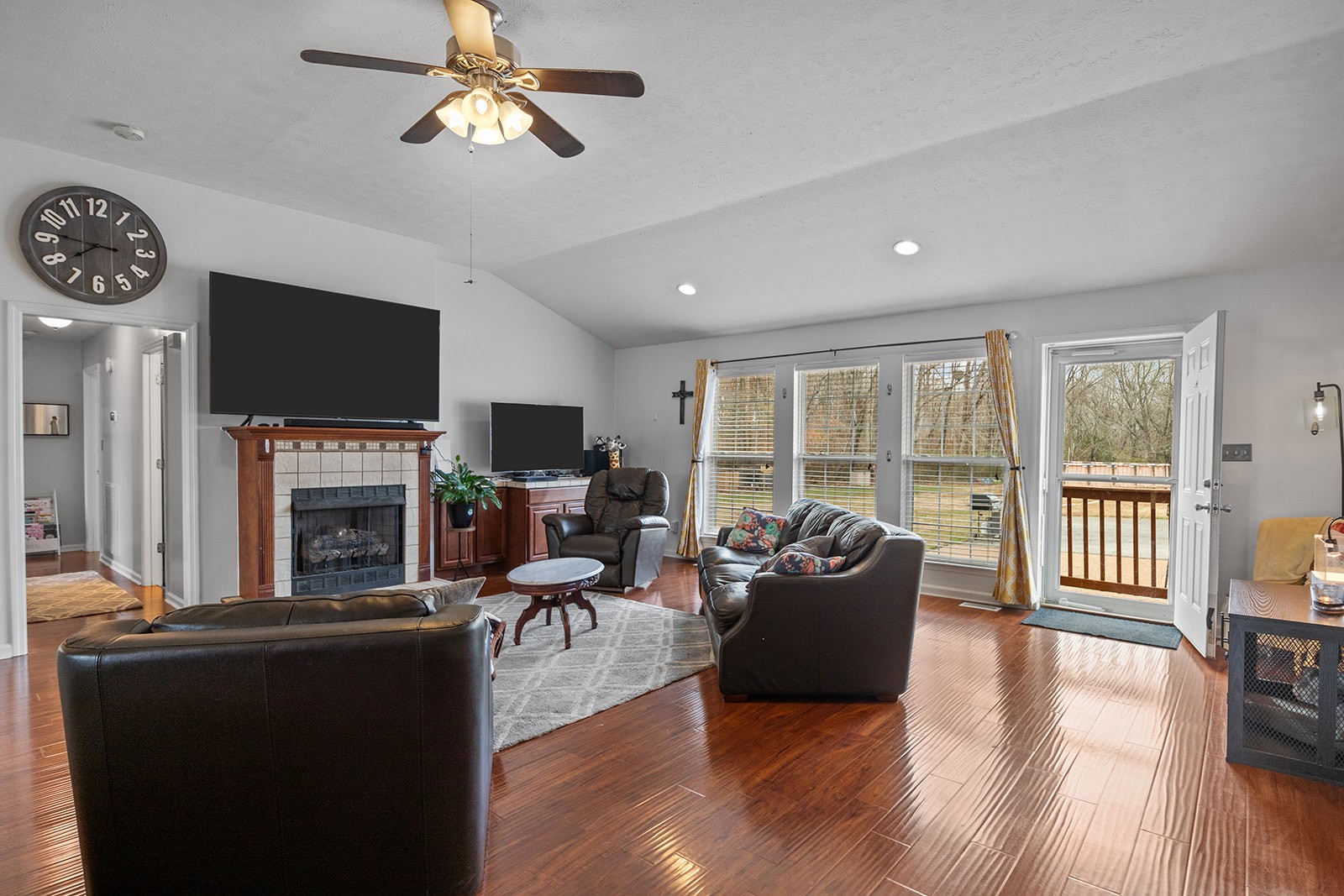1714 West Grab Creek Road Dickson, TN 37055 - Photo 10 of 26 a living room with furniture a fireplace and a flat screen tv