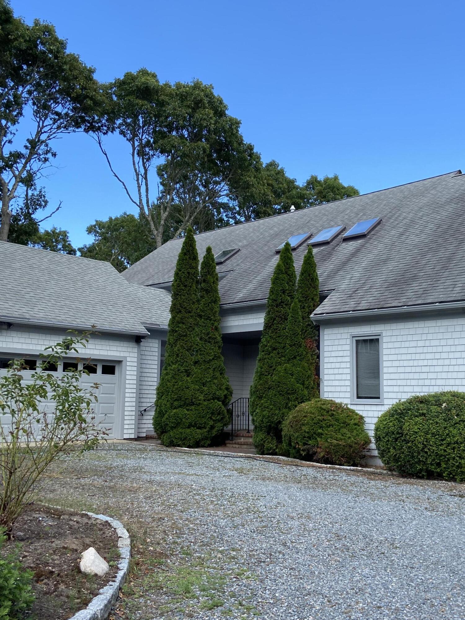 108 Waterside Drive Centerville, MA 02632 - Photo 12 of 64 front view of a house with a yard