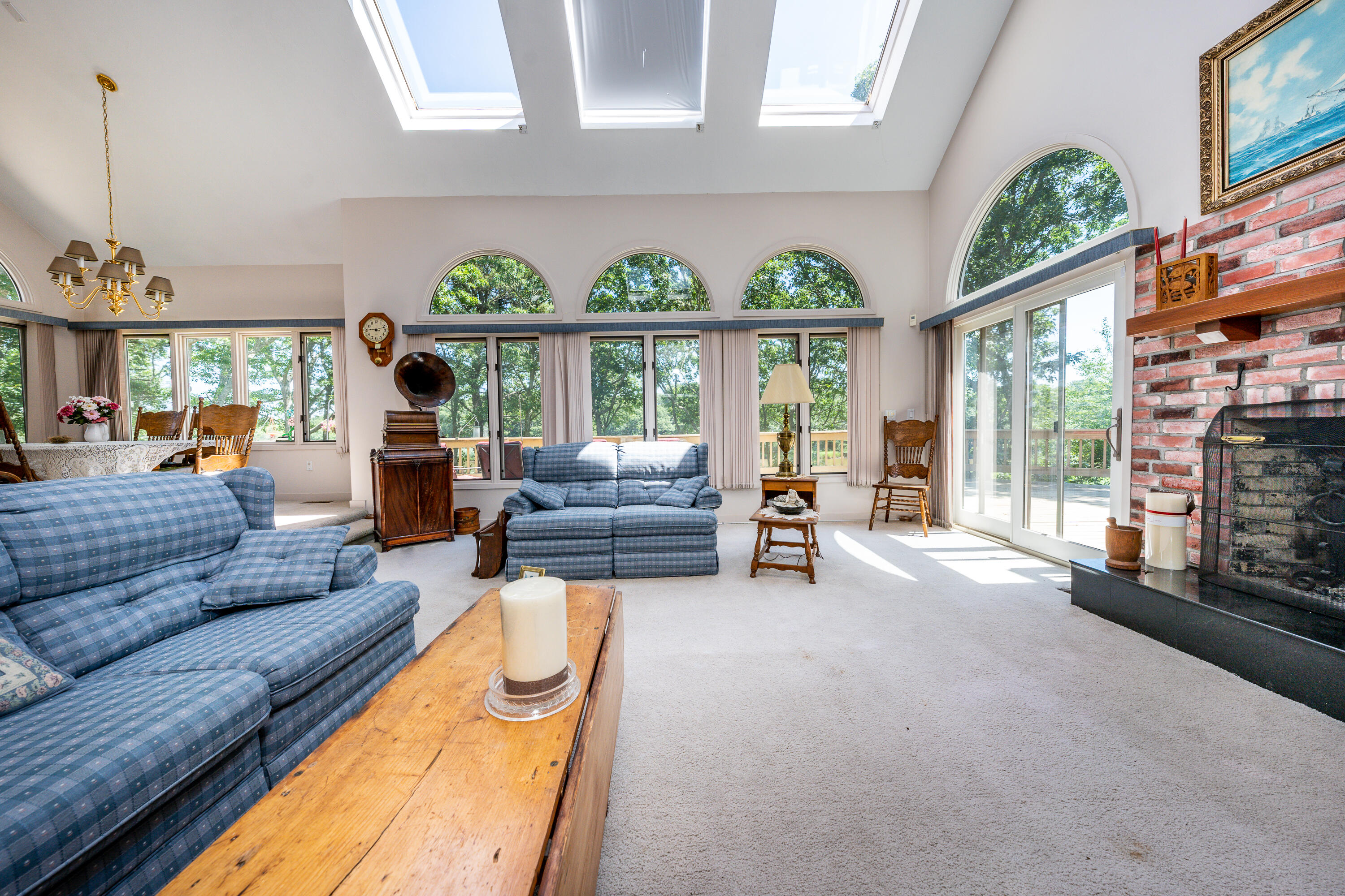 108 Waterside Drive Centerville, MA 02632 - Photo 18 of 64 a living room with furniture a fireplace and a large window