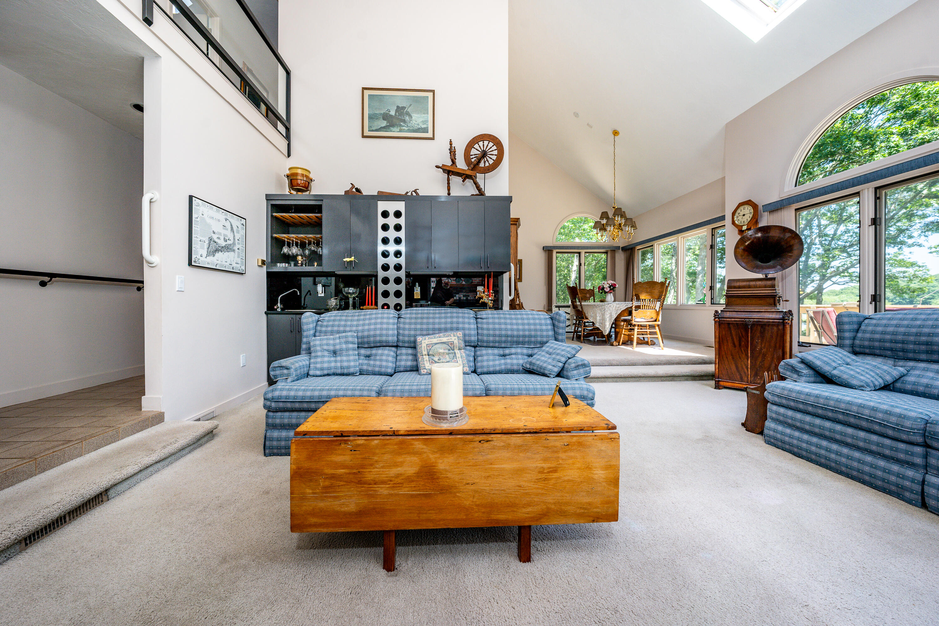 108 Waterside Drive Centerville, MA 02632 - Photo 21 of 64 a living room with furniture and a clock