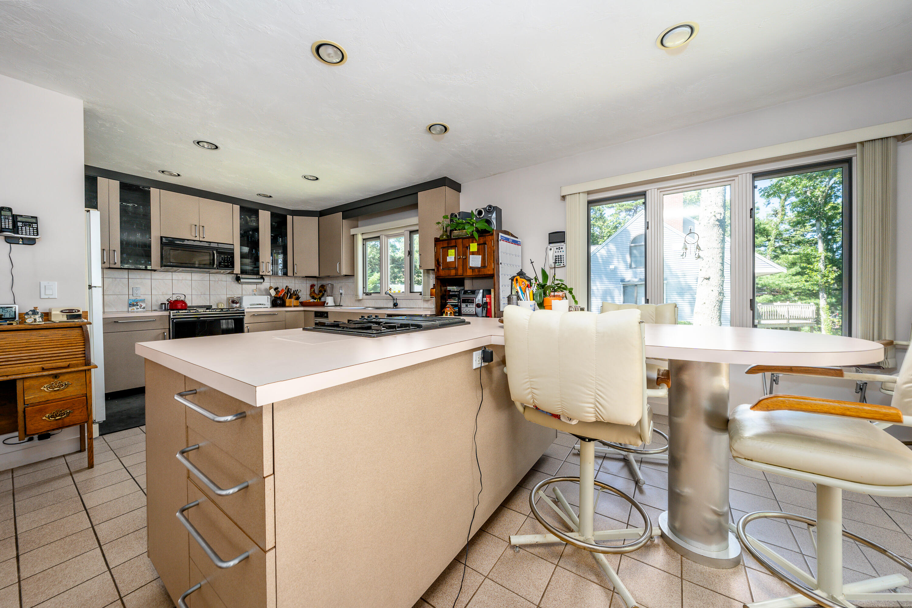 108 Waterside Drive Centerville, MA 02632 - Photo 28 of 64 a kitchen that has a cabinets counter space and a stove