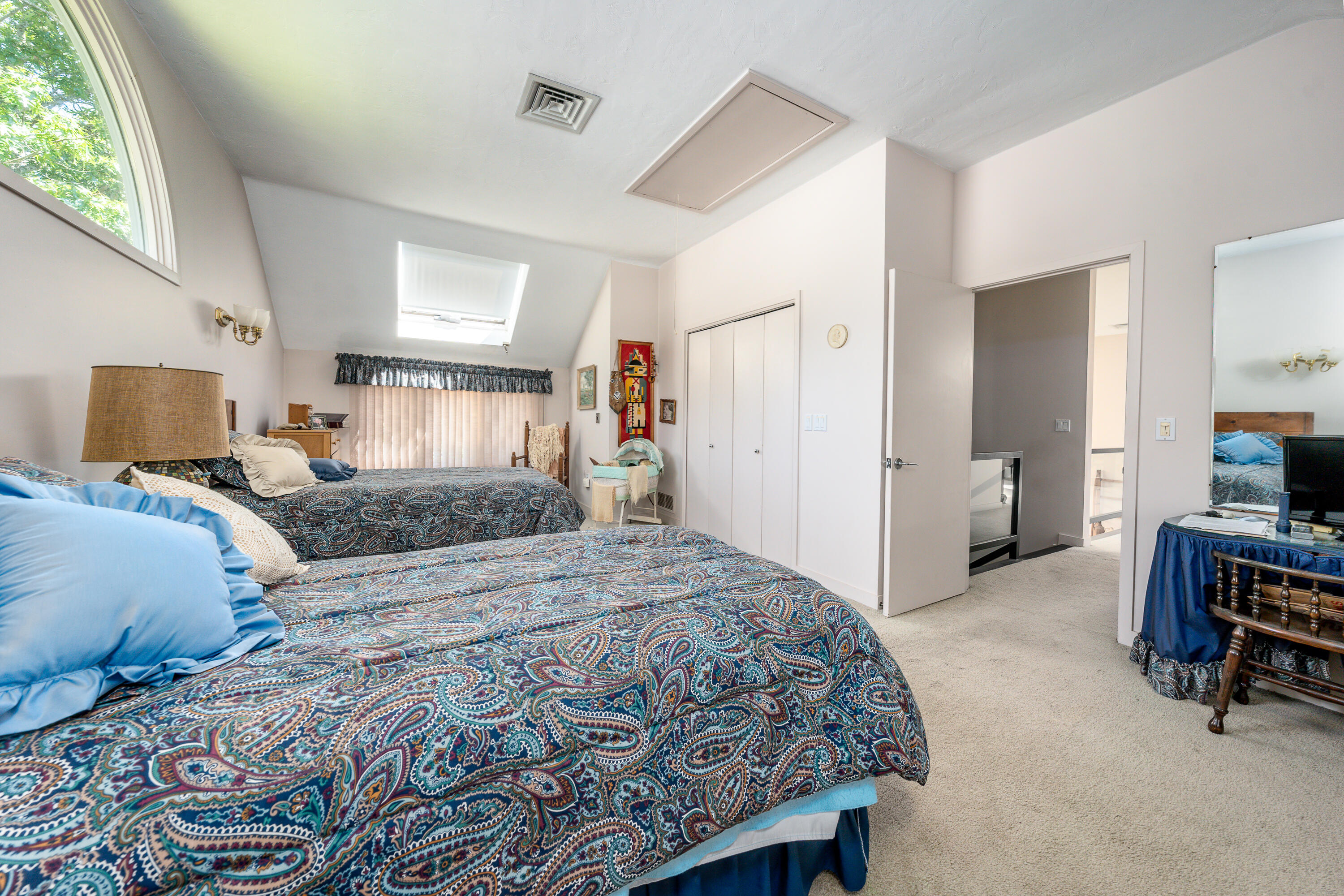 108 Waterside Drive Centerville, MA 02632 - Photo 39 of 64 a bedroom with a large bed and a tv