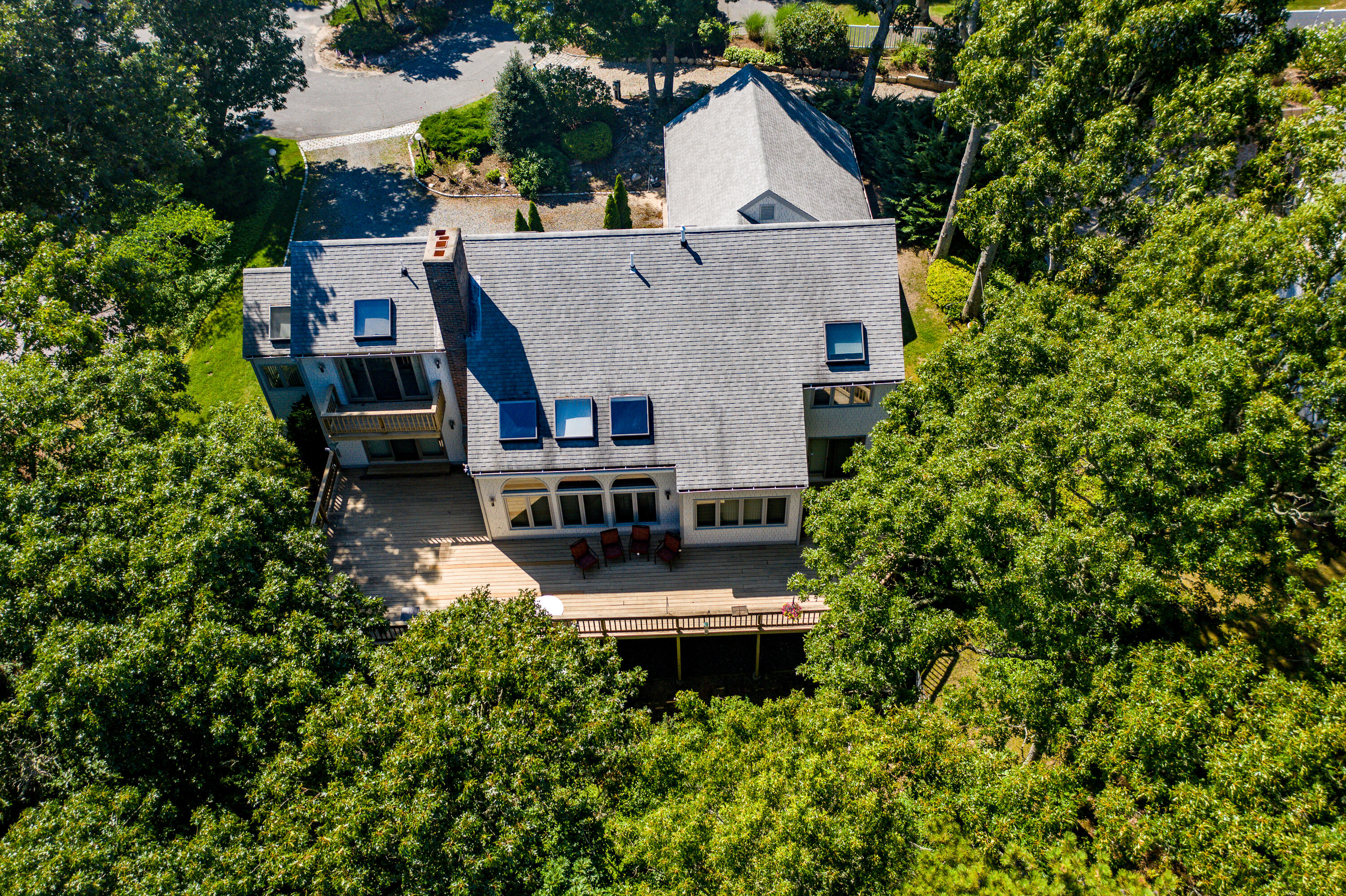 108 Waterside Drive Centerville, MA 02632 - Photo 57 of 64 a aerial view of a house with swimming pool next to a yard
