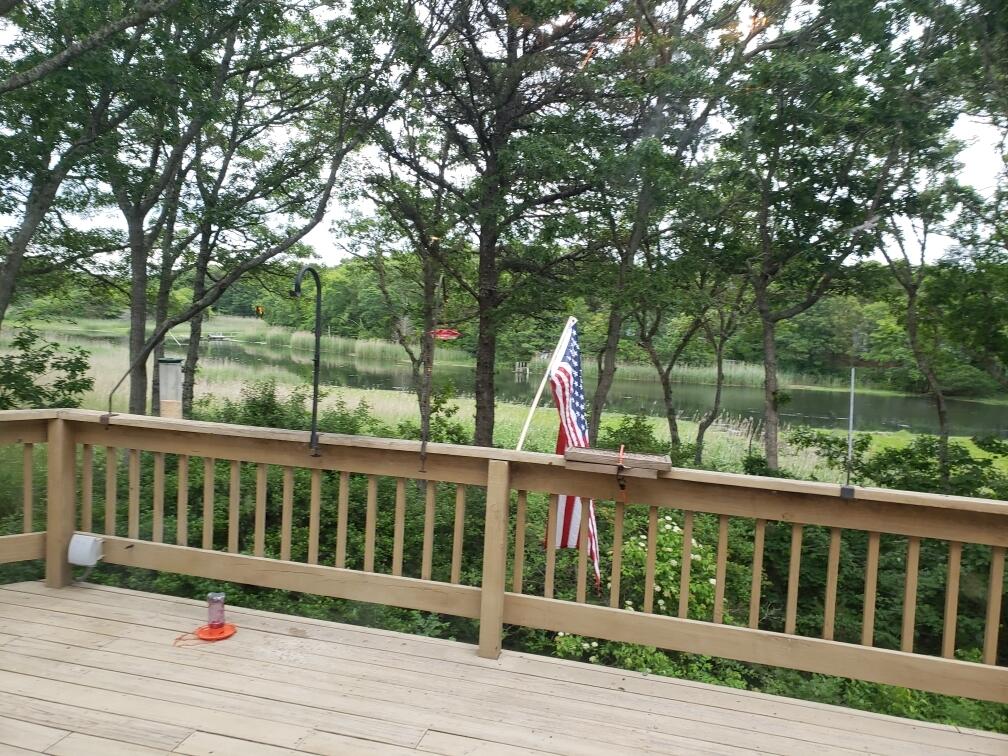 108 Waterside Drive Centerville, MA 02632 - Photo 8 of 64 a view of wooden deck and a yard