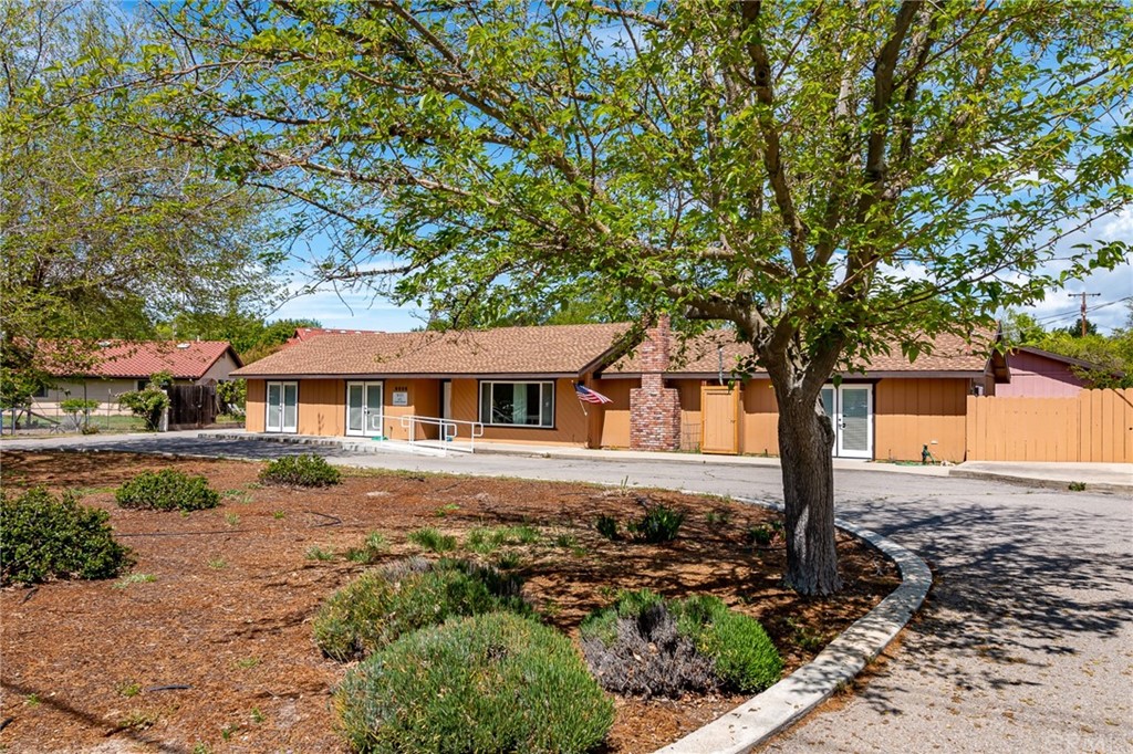 8505 Santa Rosa Road Atascadero, CA 93422 - Photo 1 of 1 a front view of a house with a garden