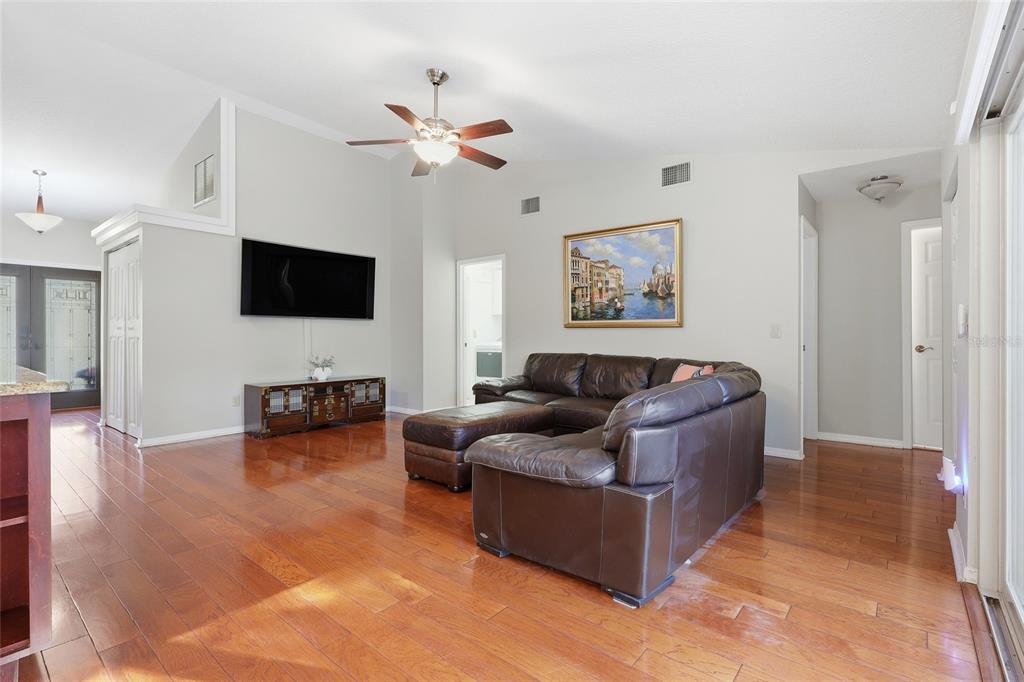 3488 Ridge Boulevard Palm Harbor, FL 34684 - Photo 6 of 30 a living room with furniture and a flat screen tv