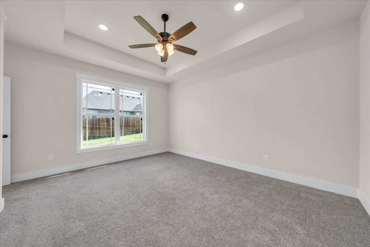 112 Riley Creek Road Tullahoma, TN 37388 - Photo 27 of 54 en empty room with windows and ceiling fan