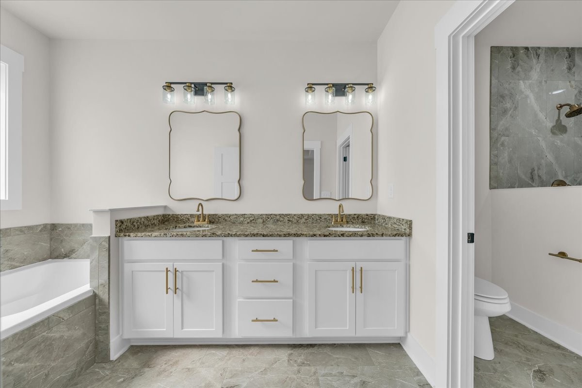 112 Riley Creek Road Tullahoma, TN 37388 - Photo 28 of 54 a bathroom with a granite countertop sink and a mirror