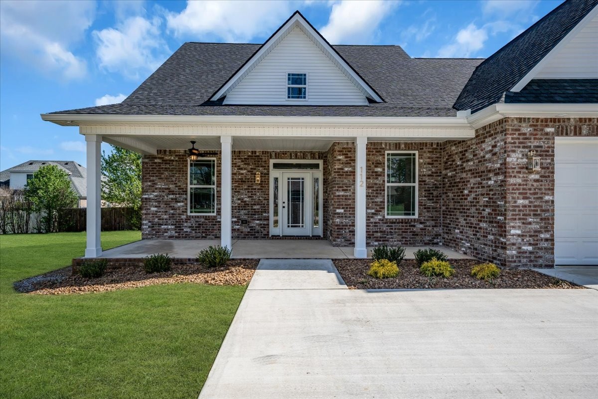 112 Riley Creek Road Tullahoma, TN 37388 - Photo 3 of 54 a front view of a house with garden