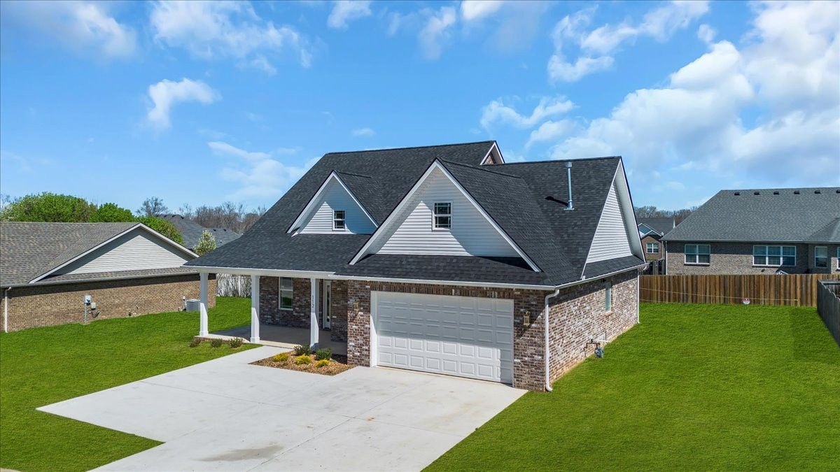 112 Riley Creek Road Tullahoma, TN 37388 - Photo 45 of 54 a view of a house with a big yard and large tree