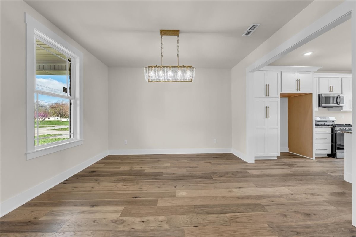 112 Riley Creek Road Tullahoma, TN 37388 - Photo 7 of 54 a view of empty room with wooden floor and window
