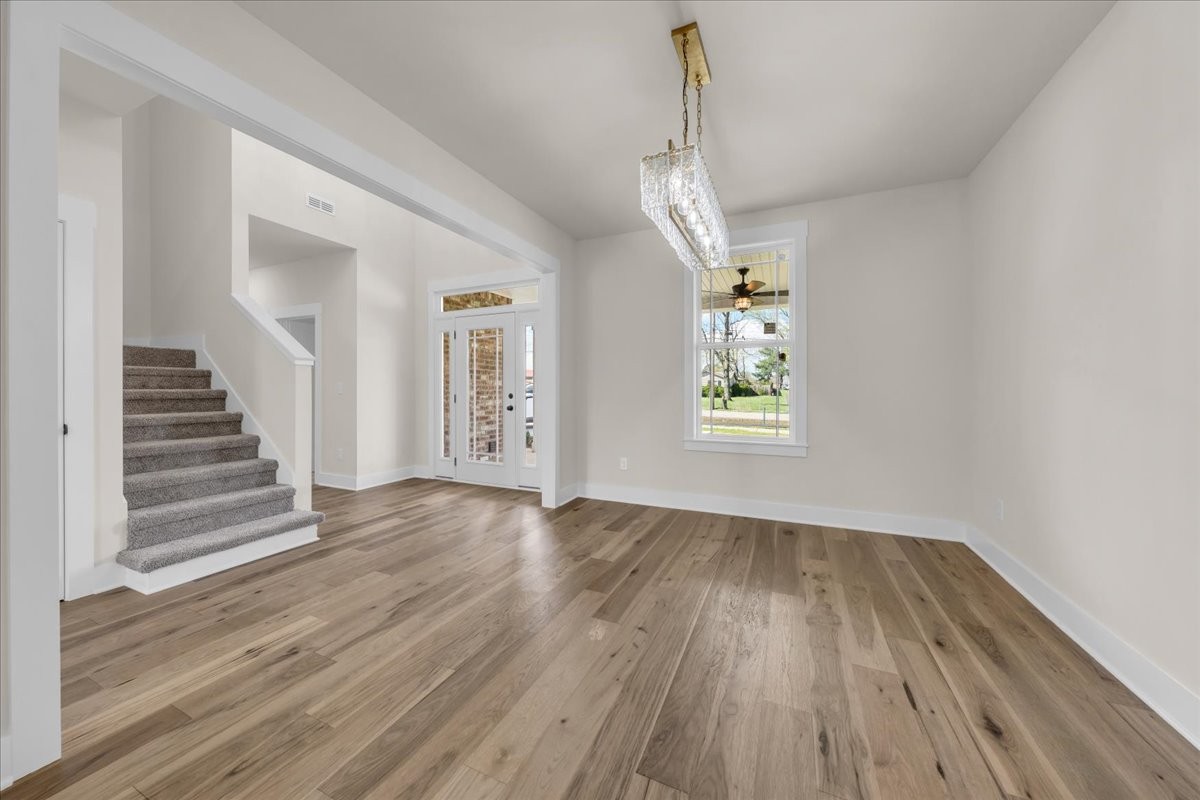 112 Riley Creek Road Tullahoma, TN 37388 - Photo 8 of 54 wooden floor in an empty room with a window