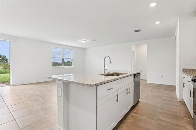 a bedroom with bed and a window