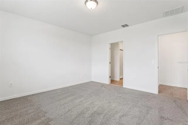 a view of an empty room and window