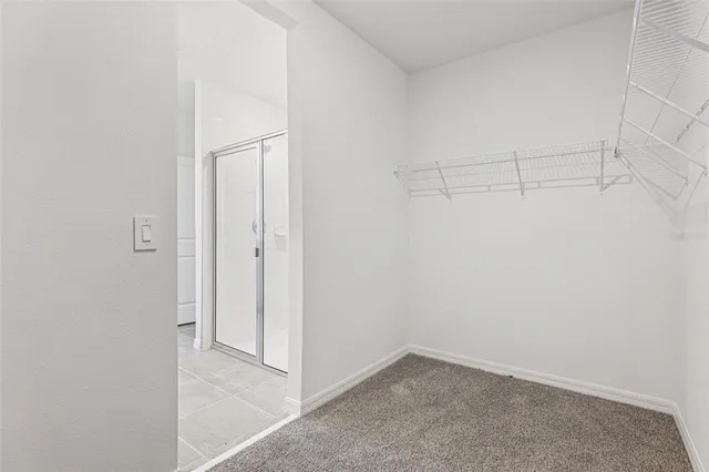 a bathroom with a glass shower door