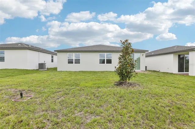 a view of house with yard and front view