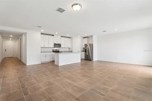 a view of a kitchen with a sink and an oven
