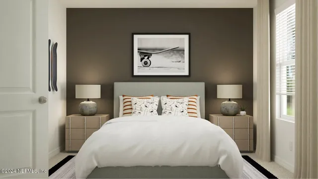 a bedroom with a bed and a wall painting