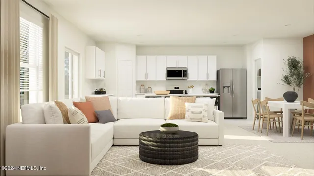 a kitchen with a refrigerator a stove cabinets and a dining table