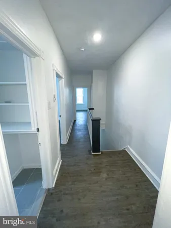 a view of an empty room with a fireplace