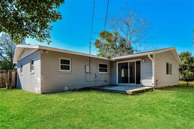 a view of a house with a yard