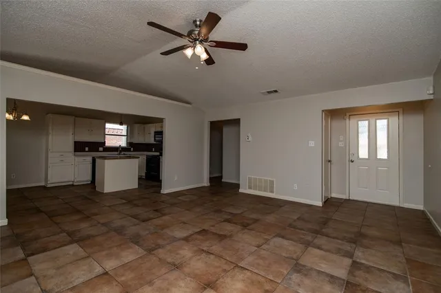 a view of a kitchen with a sink and a stove top oven