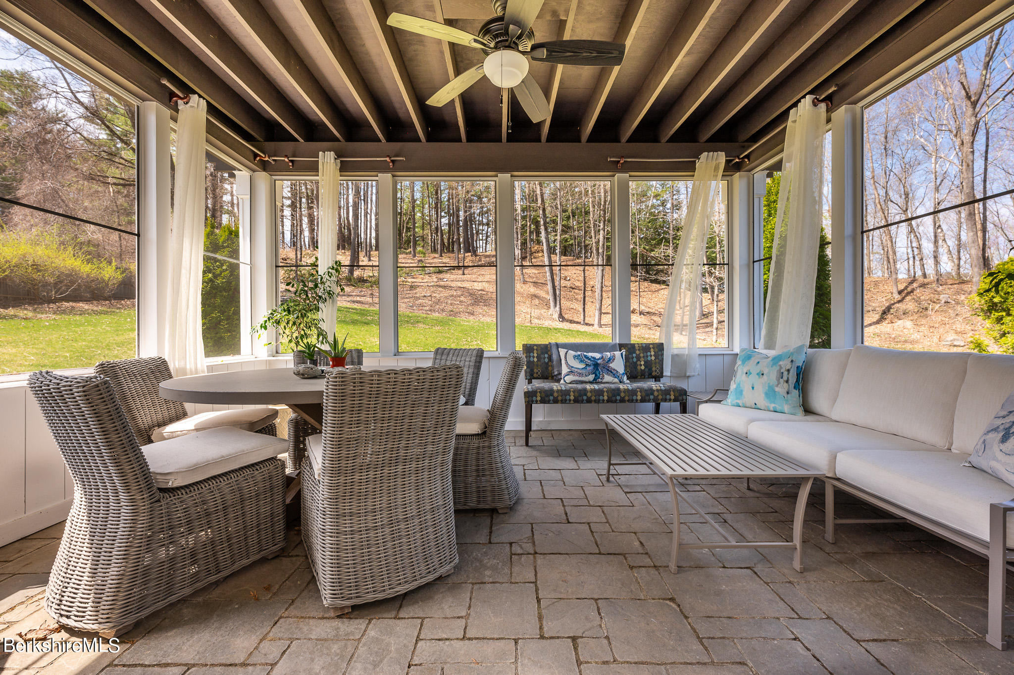 8 Castle Hill Road Stockbridge, MA 01262 - Photo 18 of 46 a dining room with furniture and large windows