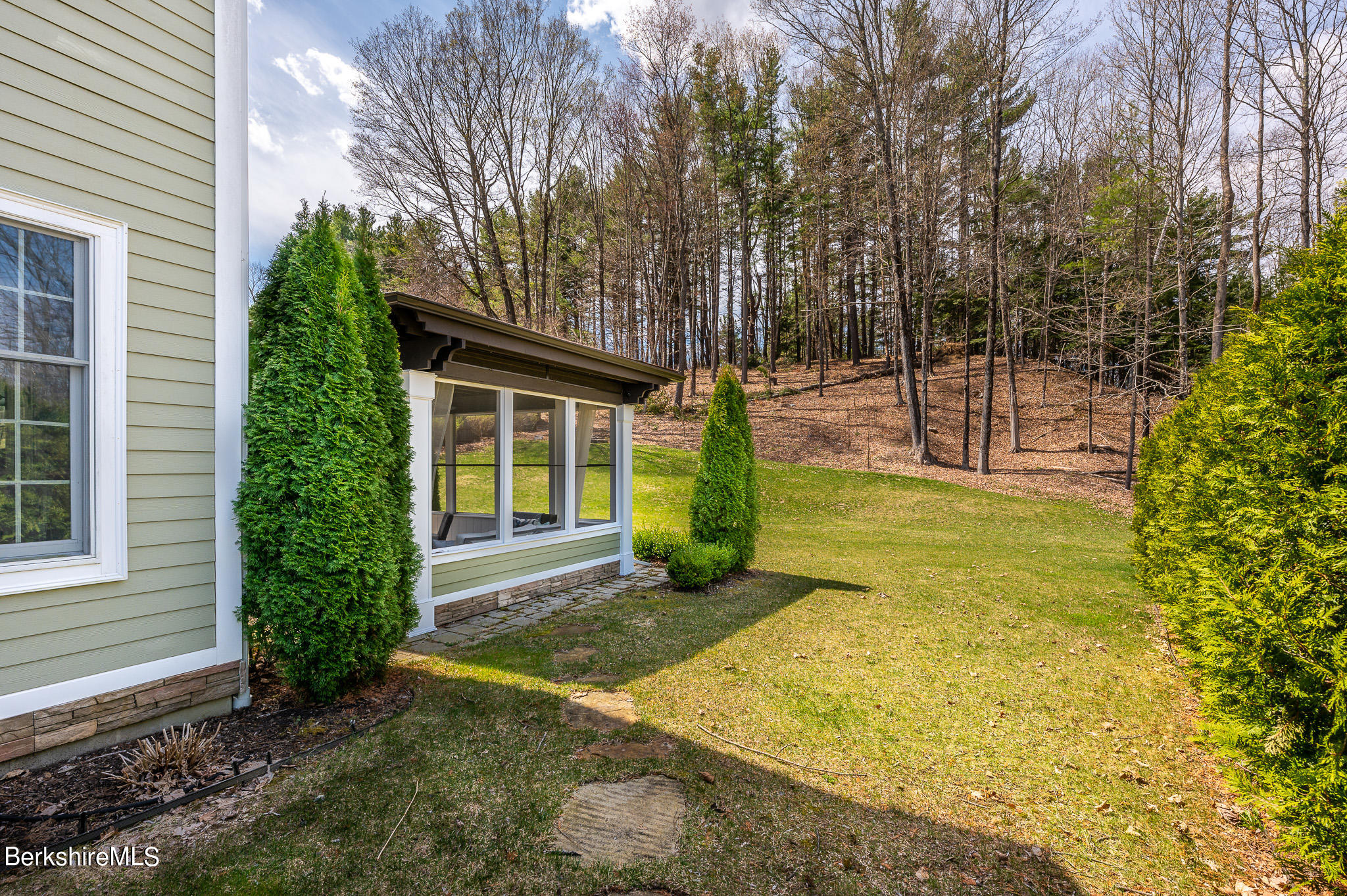 8 Castle Hill Road Stockbridge, MA 01262 - Photo 20 of 46 a view of a house with backyard and trees
