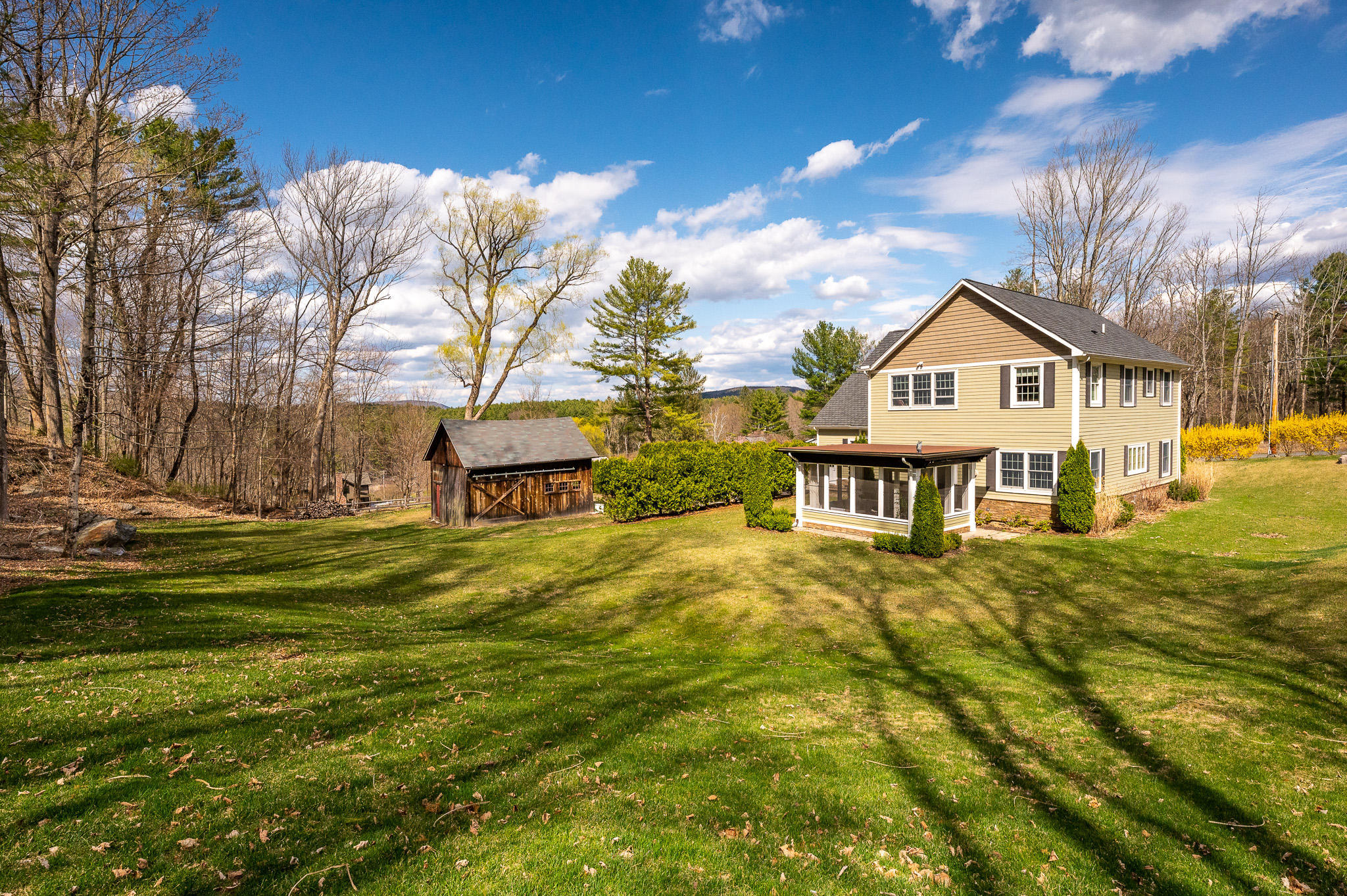 8 Castle Hill Road Stockbridge, MA 01262 - Photo 41 of 46 a view of a house with a big yard and large trees