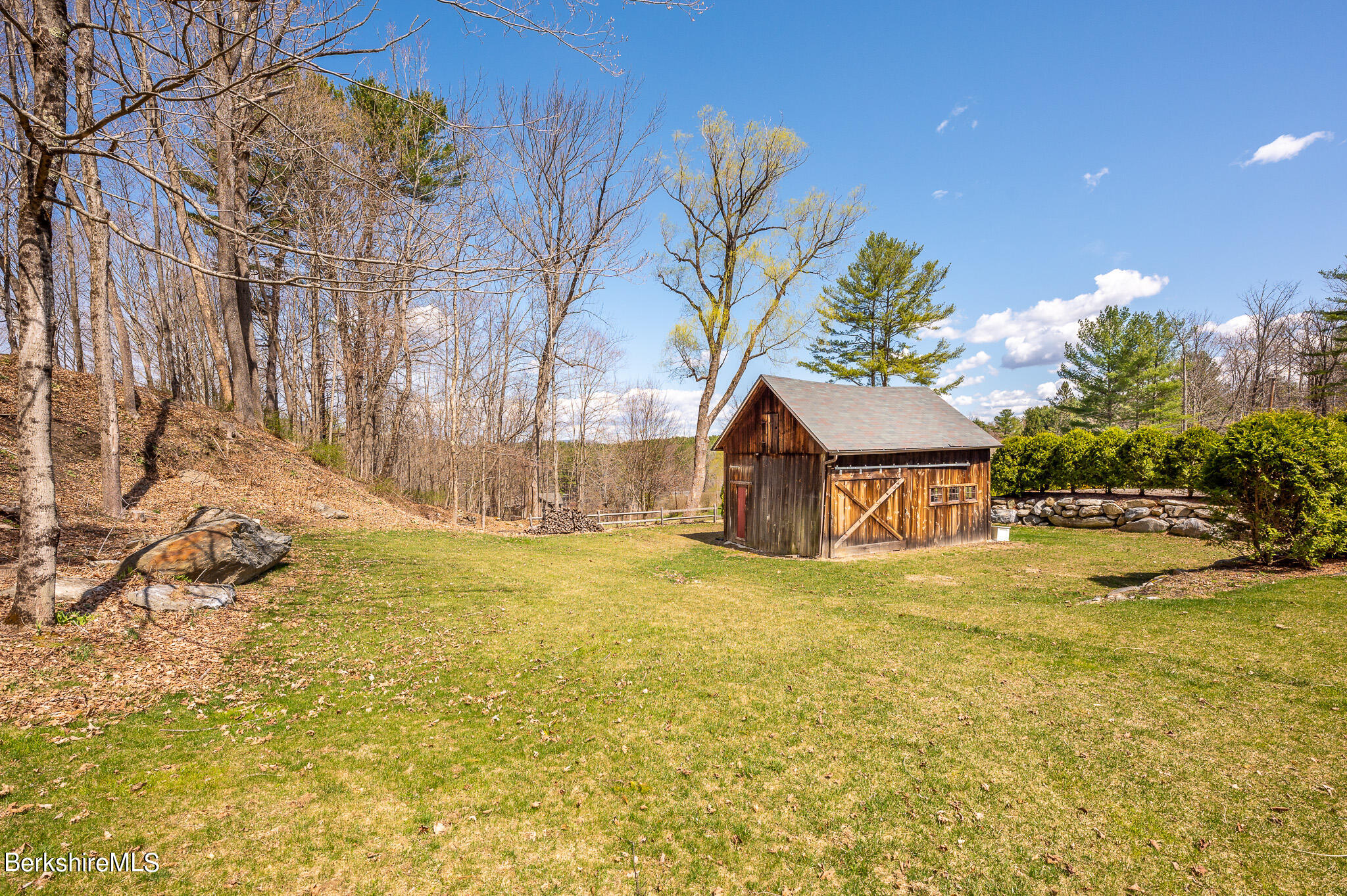 8 Castle Hill Road Stockbridge, MA 01262 - Photo 43 of 46 a yellow house with a yard in front of it