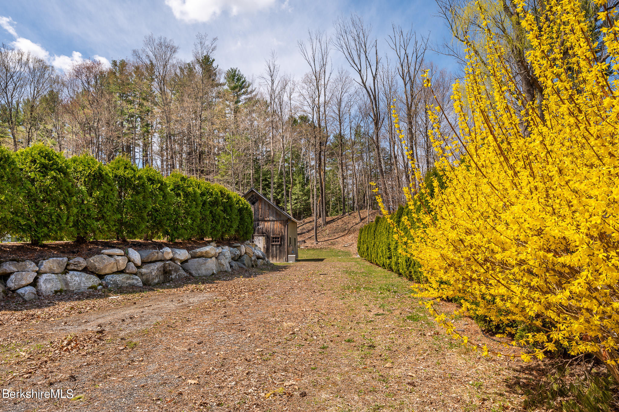 8 Castle Hill Road Stockbridge, MA 01262 - Photo 6 of 46 a view of a wooden bench with some trees