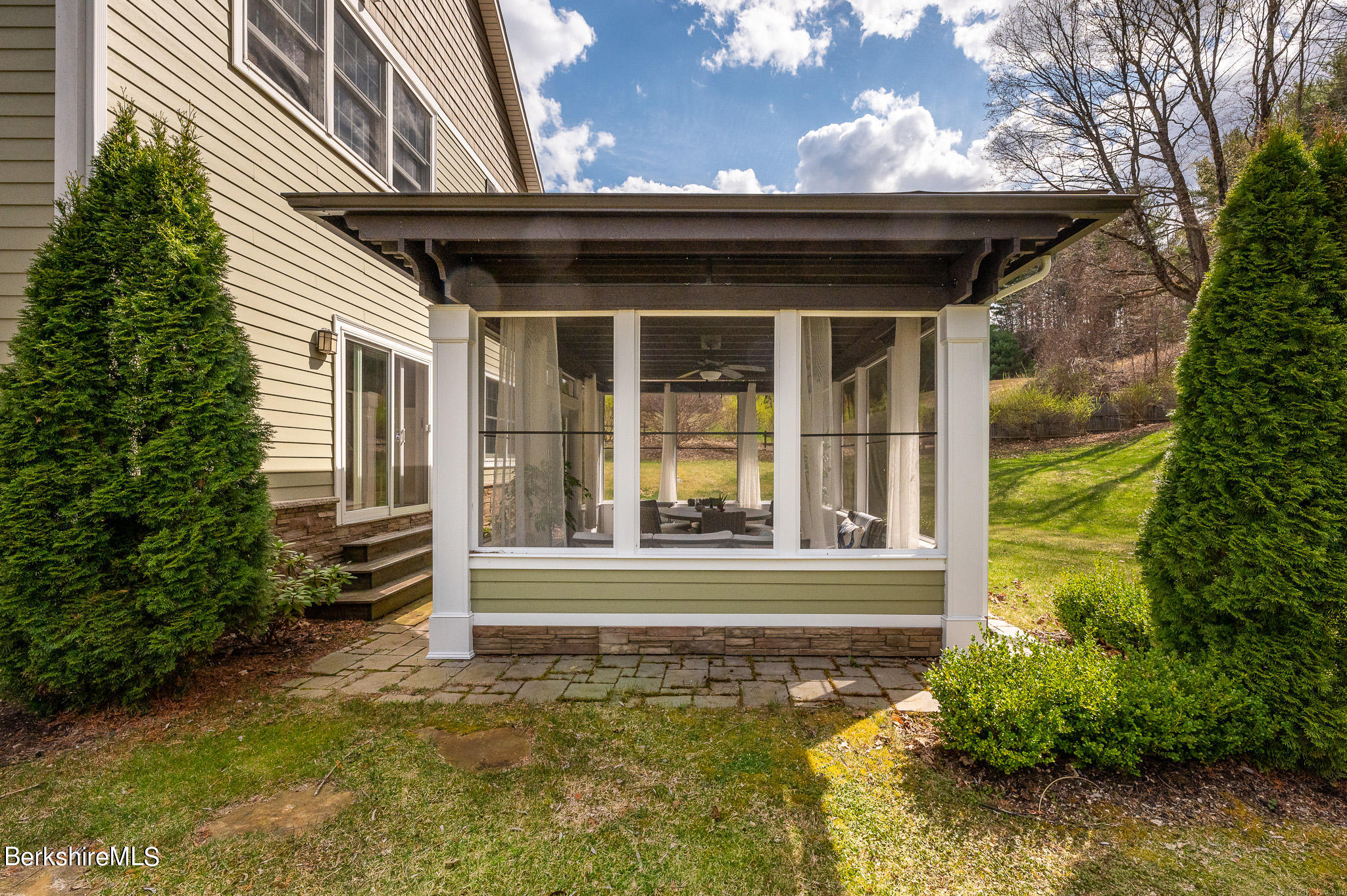 8 Castle Hill Road Stockbridge, MA 01262 - Photo 8 of 46 a view of a house with a large window and plants