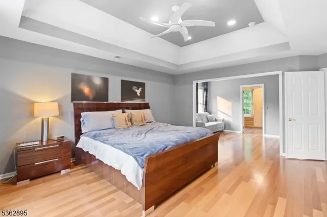 a bed room with a bed and a night stand