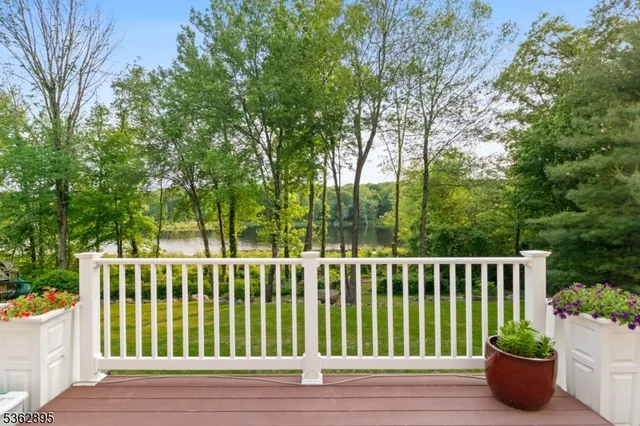 a view of a house with a wooden deck