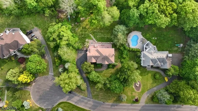 an aerial view of a house with a garden and yard