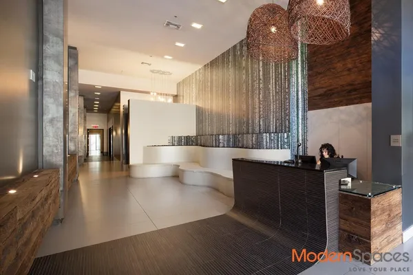 a view of a living room and a balcony