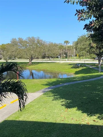 a view of a brick house with many windows