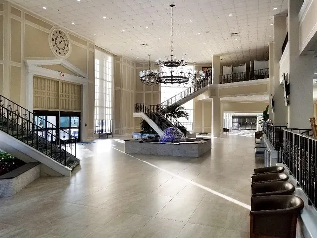 a view of dining room with furniture and floor to ceiling window