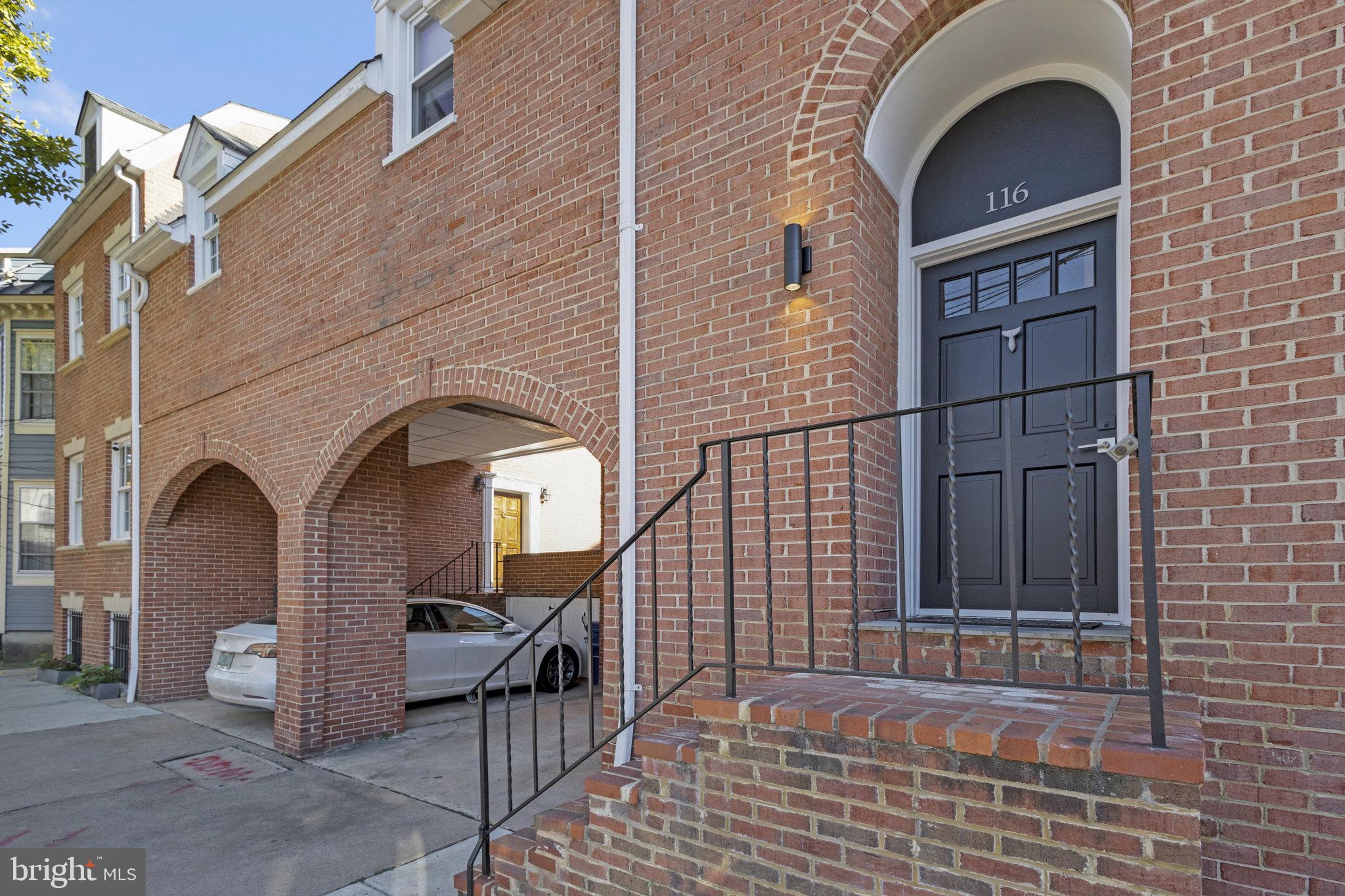 116 Commerce Street Alexandria, VA 22314 - Photo 2 of 50 Charming brick entrance with modern flair.