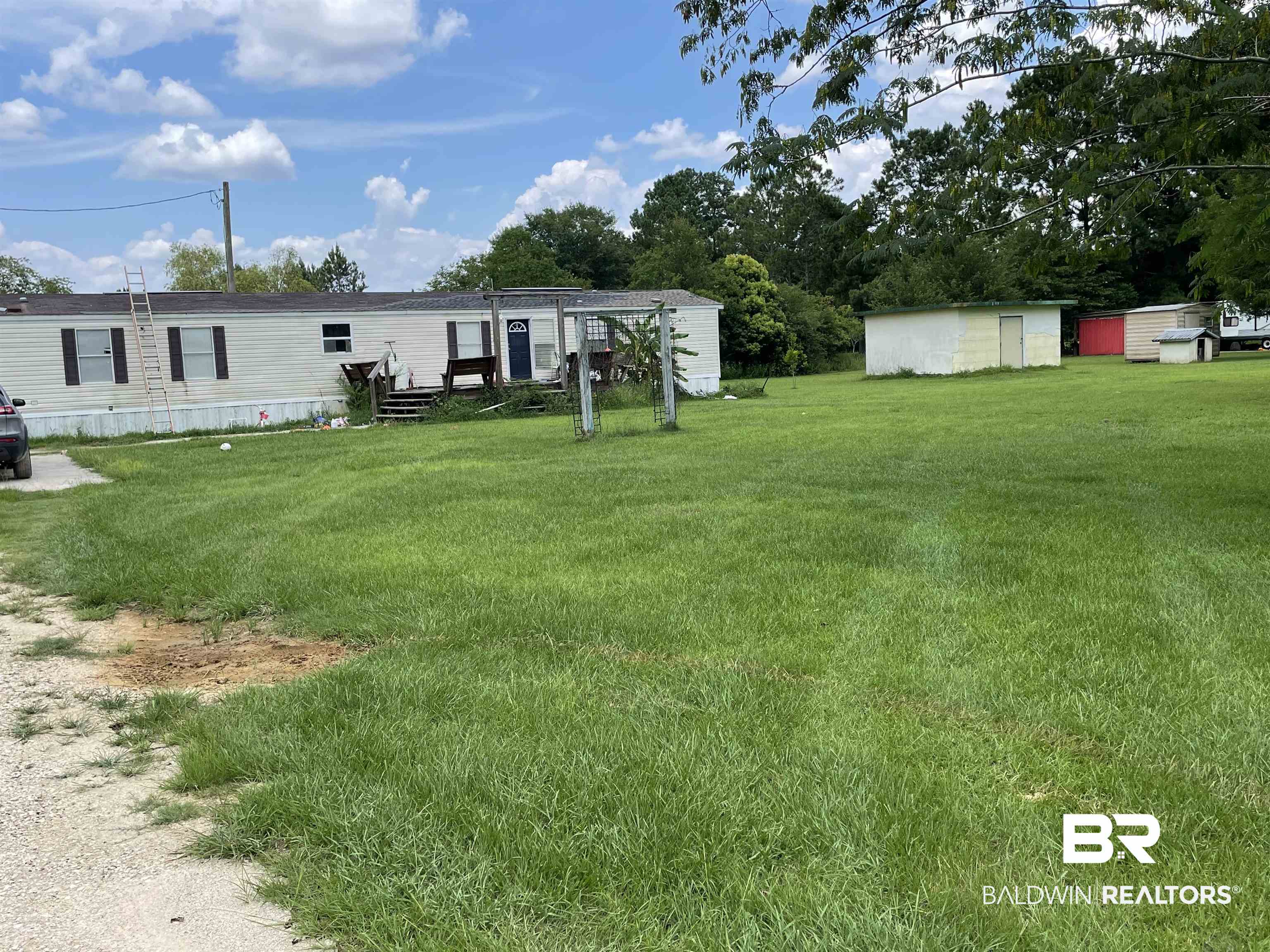 12753 Breman Road Elberta, AL 36530 - Photo 3 of 14 View of yard featuring an outbuilding