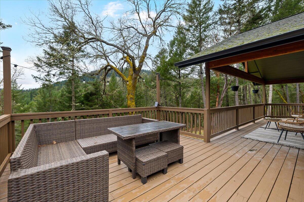350 Splendor Drive Wilderville, OR 97543 - Photo 37 of 57 a view of roof deck with seating yard and trees