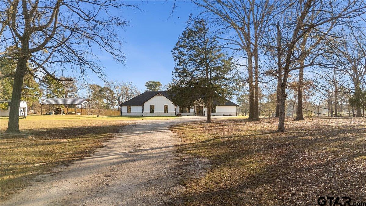 2680 Primera Road Tyler, TX 75705 - Photo 2 of 47 a view of road with trees