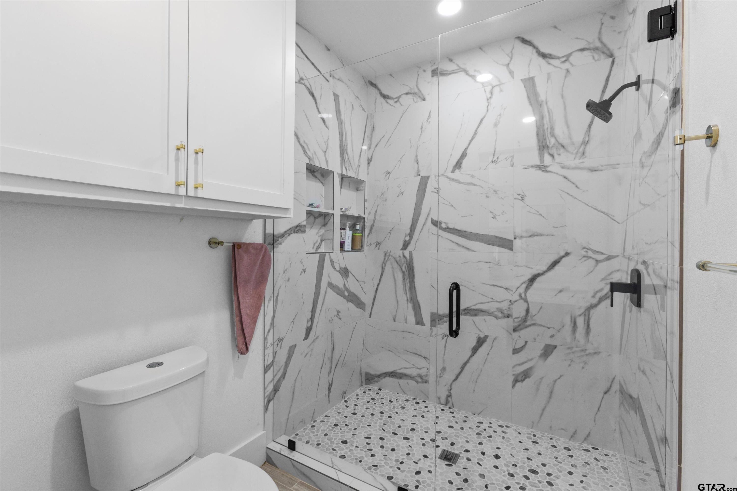 2680 Primera Road Tyler, TX 75705 - Photo 24 of 47 a bathroom with a shower toilet and sink