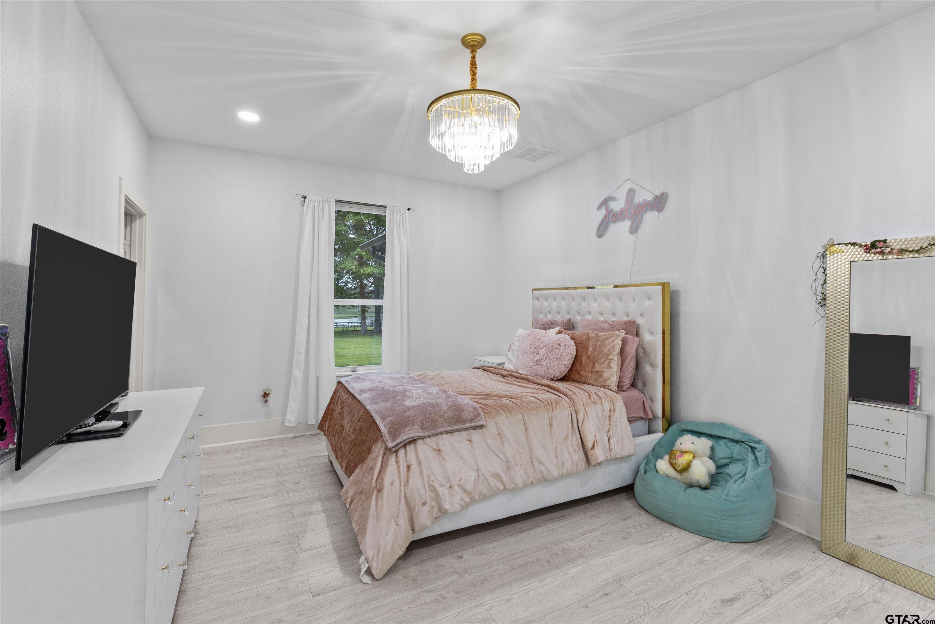 2680 Primera Road Tyler, TX 75705 - Photo 25 of 47 a bedroom with a bed and a television