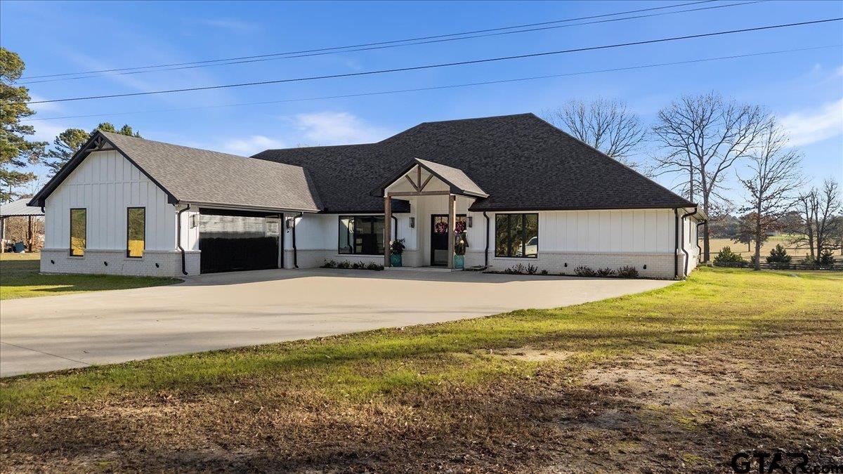 2680 Primera Road Tyler, TX 75705 - Photo 3 of 47 a front view of a house with a yard
