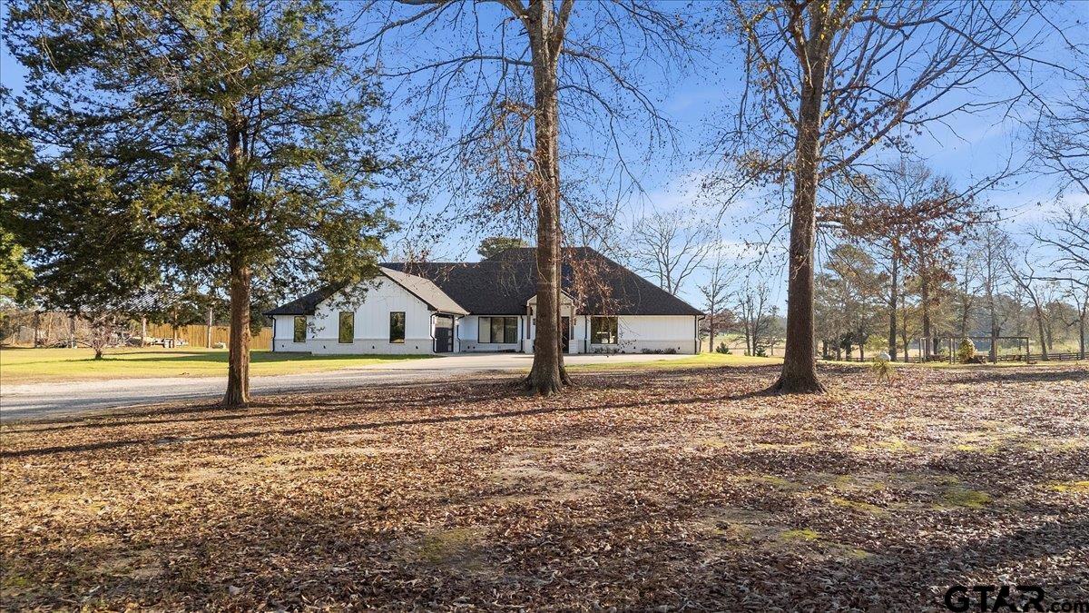 2680 Primera Road Tyler, TX 75705 - Photo 37 of 47 a house with trees in front of it