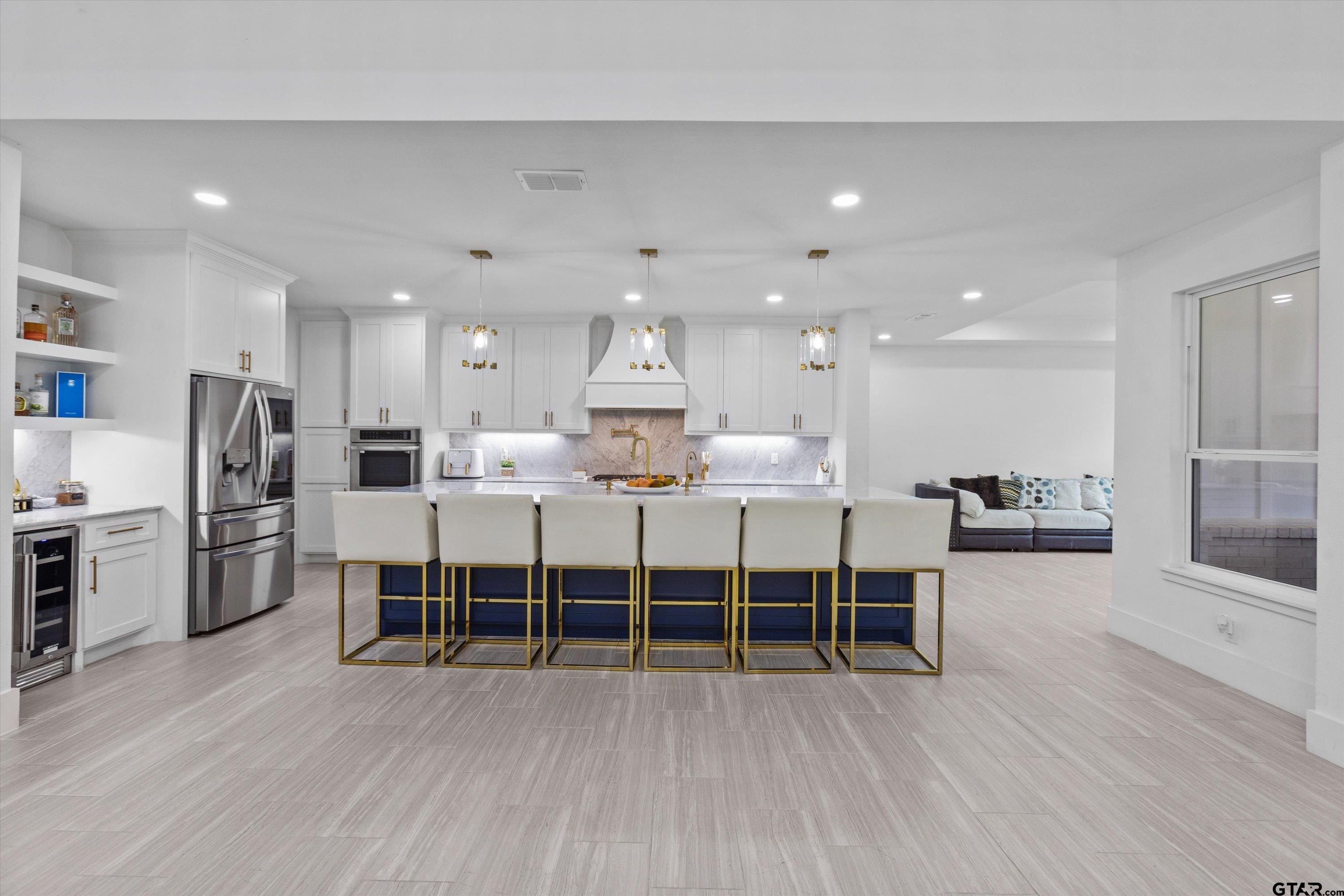 2680 Primera Road Tyler, TX 75705 - Photo 7 of 47 a large kitchen with a table and chairs