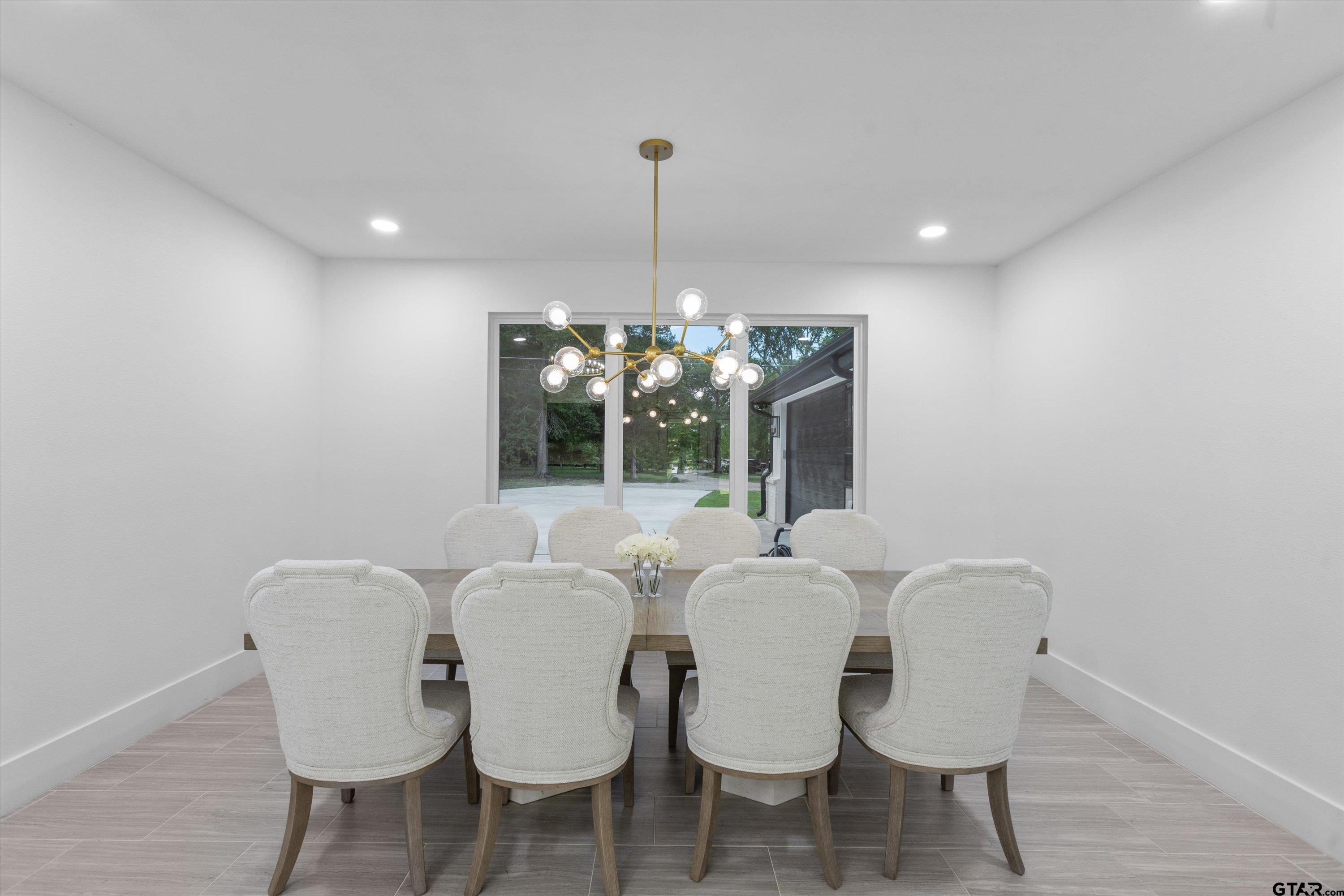 2680 Primera Road Tyler, TX 75705 - Photo 10 of 47 a view of a dining room with furniture and chandelier