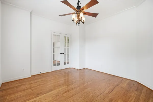 a bedroom with furniture and a large window
