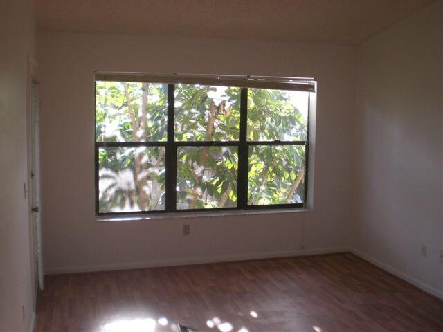 4341 West McNab Road, Unit 29 Pompano Beach, FL 33069 - Photo 5 of 10 an empty room with a window